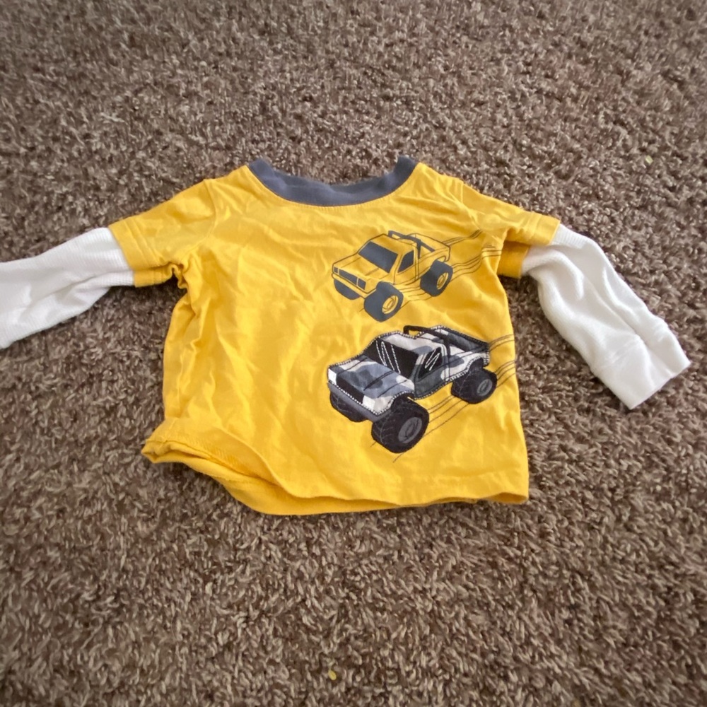 Baby shirt with trucks on it